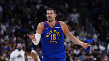 May 9, 2025; Denver, Colorado, USA; Denver Nuggets center Nikola Jokic (15) reacts to a foul called in the first half against the Oklahoma City Thunder during game three of the second round for the 2025 NBA Playoffs at Ball Arena. Mandatory Credit: Ron Chenoy-Imagn Images
