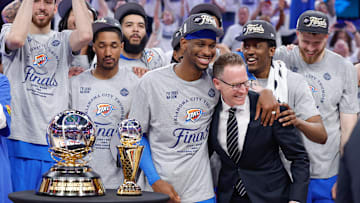Oklahoma City Thunder guard Shai Gilgeous-Alexander hugs Oklahoma City Thunder executive vice president and general manager Sam Presti after their team defeated the Minnesota Timberwolves in game five of the western conference finals for the 2025 NBA Playoffs at Paycom Center. 