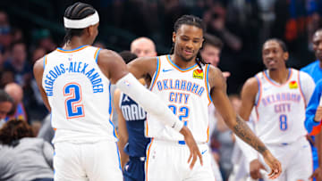 May 11, 2024; Dallas, Texas, USA; Oklahoma City Thunder guard Cason Wallace (22) celebrates with Oklahoma City Thunder guard Shai Gilgeous-Alexander (2) after scoring during the first half against the Dallas Mavericks during game three of the second round for the 2024 NBA playoffs at American Airlines Center. Mandatory Credit: Kevin Jairaj-Imagn Images