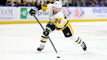 Jan 17, 2025; Buffalo, New York, USA;  Pittsburgh Penguins defenseman Matt Grzelcyk (24) makes a pass during the first period against the Buffalo Sabres at KeyBank Center. Mandatory Credit: Timothy T. Ludwig-Imagn Images