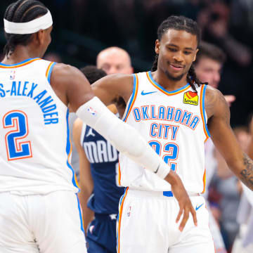 May 11, 2024; Dallas, Texas, USA; Oklahoma City Thunder guard Cason Wallace (22) celebrates with Oklahoma City Thunder guard Shai Gilgeous-Alexander (2) after scoring during the first half against the Dallas Mavericks during game three of the second round for the 2024 NBA playoffs at American Airlines Center. Mandatory Credit: Kevin Jairaj-USA TODAY Sports