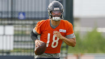 Chicago Bears quarterback Caleb Williams (18) runs with the ball during training camp at Halas Hall.
