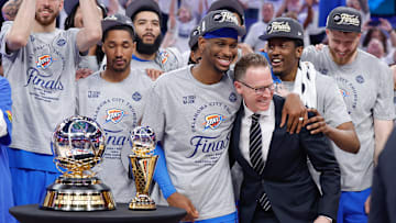 May 28, 2025; Oklahoma City, Oklahoma, USA; Oklahoma City Thunder guard Shai Gilgeous-Alexander hugs Oklahoma City Thunder executive vice president and general manager Sam Presti after their team defeated the Minnesota Timberwolves in game five of the western conference finals for the 2025 NBA Playoffs at Paycom Center. Mandatory Credit: Alonzo Adams-Imagn Images