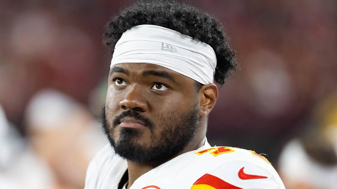 Aug 9, 2025; Glendale, Arizona, USA; Kansas City Chiefs guard Jaylon Moore (77) against the Arizona Cardinals during a preseason NFL game at State Farm Stadium. Mandatory Credit: Mark J. Rebilas-Imagn Images