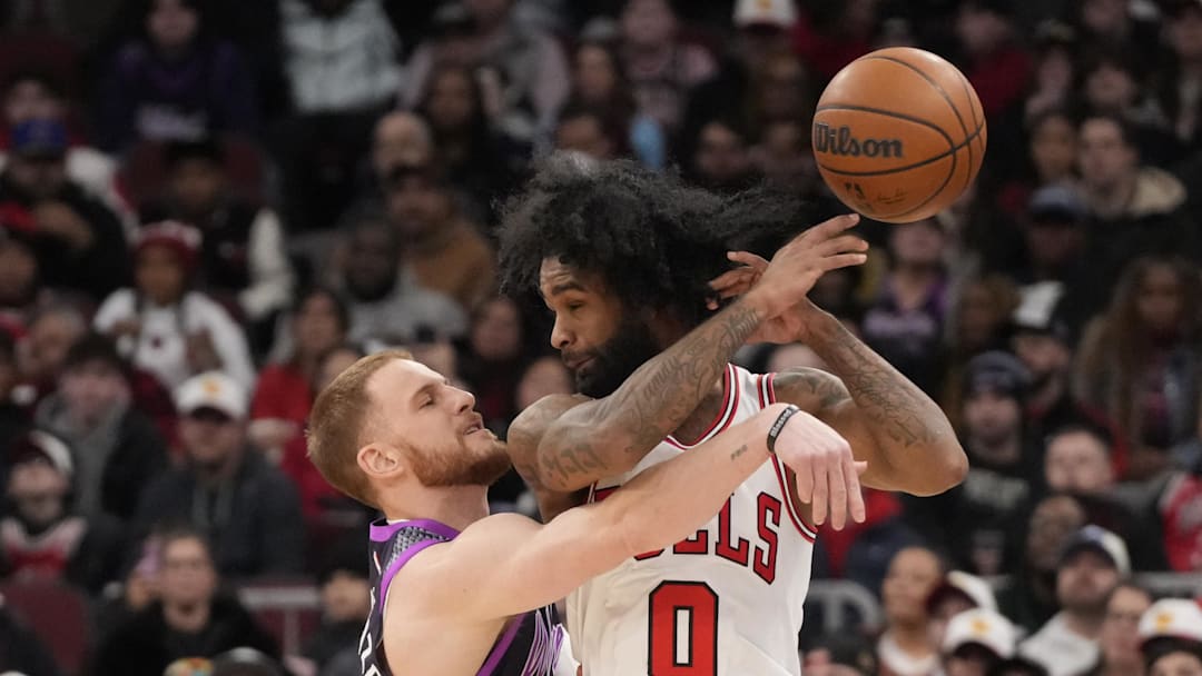 Dec 29, 2025; Chicago, Illinois, USA; Minnesota Timberwolves guard Donte Divincenzo (0) defends Chicago Bulls guard Coby White (0) during the first half at United Center. Mandatory Credit: David Banks-Imagn Images