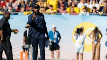 Dec 31, 2024; Tampa, FL, USA; Michigan Wolverines head coach Sherrone Moore gestures from the field against the Alabama Crimson Tide during the second half at Raymond James Stadium. Mandatory Credit: Matt Pendleton-Imagn Images