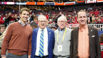Dec 3, 2022; Atlanta, GA, USA; (L to R) Former NFL quarterbacks Eli Manning, Archie Manning, and Peyton Manning pose with SEC Commissioner Greg Sankey (2nd Left) prior to the SEC Championship game between the Georgia Bulldogs and the LSU Tigers at Mercedes-Benz Stadium. Mandatory Credit: Brett Davis-USA TODAY Sports