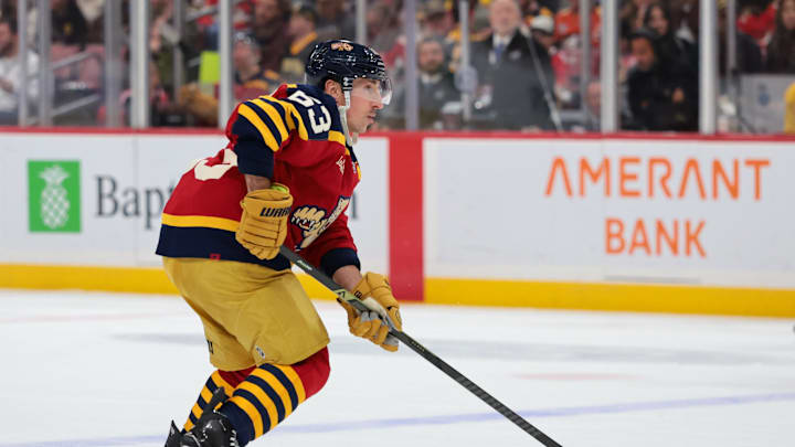 Feb 4, 2026; Sunrise, Florida, USA; Florida Panthers left wing Brad Marchand (63) moves the puck against the Boston Bruins during the first period at Amerant Bank Arena. Mandatory Credit: Sam Navarro-Imagn Images