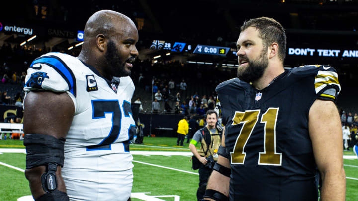 Dec 10, 2023; New Orleans, Louisiana, USA; New Orleans Saints offensive tackle Ryan Ramczyk (71) talks with Carolina Panthers offensive tackle Taylor Moton (72) after the game at the Caesars Superdome.