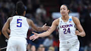 Mar 26, 2018; Albany , NY, USA; Connecticut Huskies forward Napheesa Collier (24) and guard Crystal Dangerfield (5) celebrate against the South Carolina Gamecocks during the first half in the championship game of the Albany regional of the women's basketball 2018 NCAA Tournament at the Times Union Center. Mandatory Credit: Rich Barnes-Imagn Images