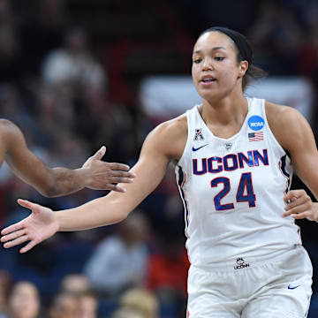 Mar 26, 2018; Albany , NY, USA; Connecticut Huskies forward Napheesa Collier (24) and guard Crystal Dangerfield (5) celebrate against the South Carolina Gamecocks during the first half in the championship game of the Albany regional of the women's basketball 2018 NCAA Tournament at the Times Union Center. Mandatory Credit: Rich Barnes-Imagn Images