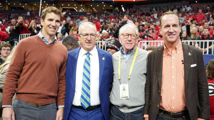 Dec 3, 2022; Atlanta, GA, USA; (L to R) Former NFL quarterbacks Eli Manning, Archie Manning, and Peyton Manning pose with SEC Commissioner Greg Sankey (2nd Left) prior to the SEC Championship game between the Georgia Bulldogs and the LSU Tigers at Mercedes-Benz Stadium. Mandatory Credit: Brett Davis-USA TODAY Sports