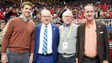 Dec 3, 2022; Atlanta, GA, USA; (L to R) Former NFL quarterbacks Eli Manning, Archie Manning, and Peyton Manning pose with SEC Commissioner Greg Sankey (2nd Left) prior to the SEC Championship game between the Georgia Bulldogs and the LSU Tigers at Mercedes-Benz Stadium. Mandatory Credit: Brett Davis-Imagn Images