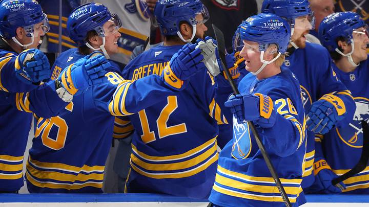 Defenseman Rasmus Dahlin with Buffalo Sabres teammates