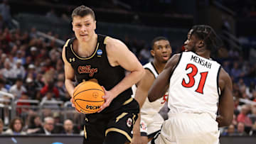 Mar 16, 2023; Orlando, FL, USA; College of Charleston Cougars forward Ante Brzovic (10) goes to the basket while defended by San Diego State Aztecs forward Nathan Mensah (31) during the second half at Amway Center. Mandatory Credit: Matt Pendleton-Imagn Images