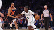 May 12, 2025; New York, New York, USA; Boston Celtics guard Jrue Holiday (4) dribbles in front of New York Knicks forward Mikal Bridges (25) in the second half during game four of the second round for the 2025 NBA Playoffs at Madison Square Garden. Mandatory Credit: Vincent Carchietta-Imagn Images