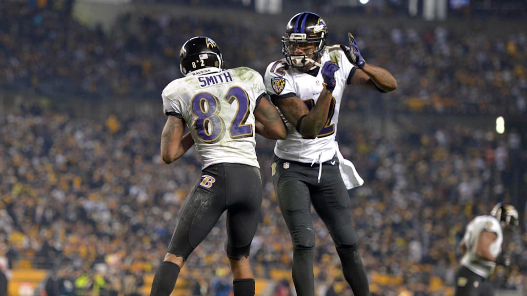 Jan 3, 2015; Pittsburgh, PA USA; Baltimore Ravens receiver Torrey Smith (82) celebrates with receiver Jacoby Jones (12) after an 11-yard touchdown reception in the third quarter during an AFC wild card playoff game against the Pittsburgh Steelers at Heinz Field. The Ravens defeated the Steelers 30-17. Mandatory Credit: Kirby Lee-USA TODAY Sports