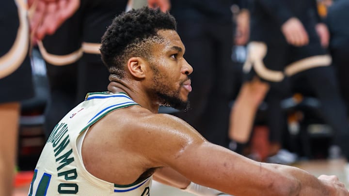 Jan 19, 2026; Atlanta, Georgia, USA; Milwaukee Bucks forward Giannis Antetokounmpo (34) sits on the ground after a collision against the Milwaukee Bucks during the fourth quarter at State Farm Arena. Mandatory Credit: Jordan Godfree-Imagn Images