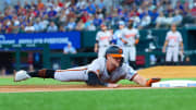 Jul 21, 2024; Arlington, Texas, USA;  Baltimore Orioles left fielder Austin Hays (21) slides into third base during the second inning against the Texas Rangers at Globe Life Field.