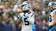 Nov 2, 2025; Green Bay, Wisconsin, USA; Carolina Panthers running back Rico Dowdle (5) celebrates after a first down against the Green Bay Packers during the second half at Lambeau Field. Mandatory Credit: Jeff Hanisch-Imagn Images
