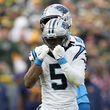 Nov 2, 2025; Green Bay, Wisconsin, USA; Carolina Panthers running back Rico Dowdle (5) celebrates after a first down against the Green Bay Packers during the second half at Lambeau Field. Mandatory Credit: Jeff Hanisch-Imagn Images