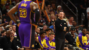 Oct 28, 2024; Phoenix, Arizona, USA; Los Angeles Lakers head coach JJ Redick with forward LeBron James (23) against the Phoenix Suns at Footprint Center. Mandatory Credit: Mark J. Rebilas-Imagn Images