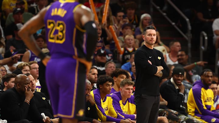 Oct 28, 2024; Phoenix, Arizona, USA; Los Angeles Lakers head coach JJ Redick with forward LeBron James (23) against the Phoenix Suns at Footprint Center. Mandatory Credit: Mark J. Rebilas-Imagn Images
