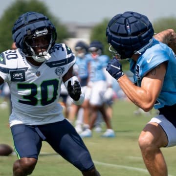 Seattle Seahawks cornerback Michael Jackson (30) guards Tennessee Titans wide receiver Mason Kinsey (12) at Ascension Saint Thomas Sports Park in Nashville, Tenn., Thursday, Aug. 15, 2024. This is the second day of the Titans joint practice with the Seattle Seahawks.