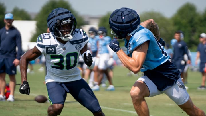 Seattle Seahawks cornerback Michael Jackson (30) guards Tennessee Titans wide receiver Mason Kinsey (12) at Ascension Saint Thomas Sports Park in Nashville, Tenn., Thursday, Aug. 15, 2024. This is the second day of the Titans joint practice with the Seattle Seahawks.