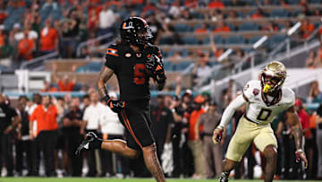 Oct 26, 2024; Miami Gardens, Florida, USA; Miami Hurricanes running back Damien Martinez (6) runs with the football for a touchdown against the Florida State Seminoles during the fourth quarter at Hard Rock Stadium. Mandatory Credit: Sam Navarro-Imagn Images
