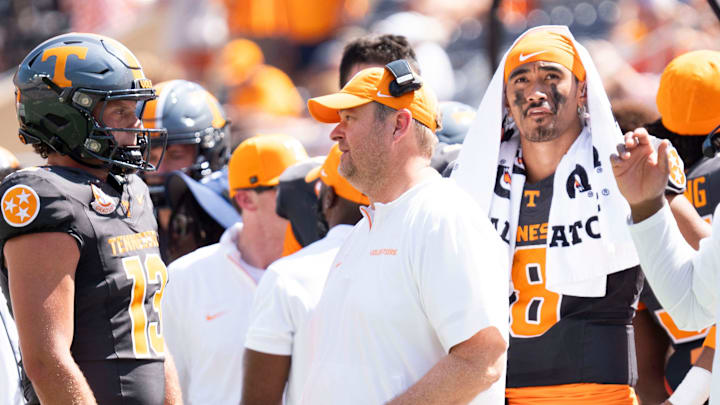 Tennessee head coach Josh Heupel speaks with Tennessee quarterback Gaston Moore (13) with Tennessee quarterback Nico Iamaleava (8) behind him, during a game between Tennessee and Chattanooga, Saturday, Aug. 31, 2024.