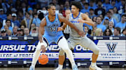 Feb 1, 2025; Philadelphia, Pennsylvania, USA; Villanova Wildcats forward Eric Dixon (43) drives against Creighton Bluejays forward Jasen Green (0) in the first half at Wells Fargo Center. Mandatory Credit: Kyle Ross-Imagn Images