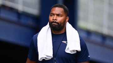 Jul 24, 2024; Foxborough, MA, USA;  New England Patriots head coach Jerod Mayo walks to the podium for a press conference before training camp at Gillette Stadium. Mandatory Credit: Eric Canha-USA TODAY Sports