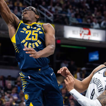 Apr 1, 2024; Indianapolis, Indiana, USA; Indiana Pacers forward Jalen Smith (25) shoots the ball while  Brooklyn Nets forward Trendon Watford (9) defends in the first half at Gainbridge Fieldhouse. Mandatory Credit: Trevor Ruszkowski-USA TODAY Sports