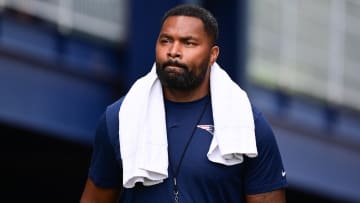 Jul 24, 2024; Foxborough, MA, USA;  New England Patriots head coach Jerod Mayo walks to the podium for a press conference before training camp at Gillette Stadium. Mandatory Credit: Eric Canha-USA TODAY Sports