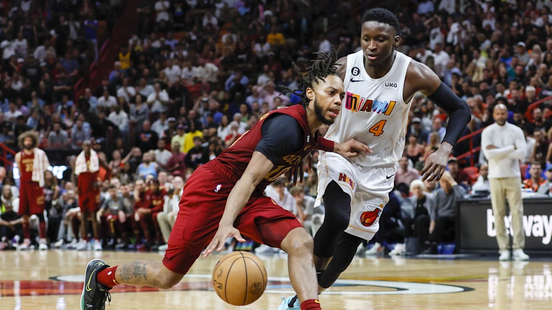Mar 8, 2023; Miami, Florida, USA; Cleveland Cavaliers guard Darius Garland (10) drives to the basket as Miami Heat guard Victor Oladipo (4) defends during the fourth quarter at Miami-Dade Arena. Mandatory Credit: Sam Navarro-Imagn Images