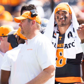 Tennessee head coach Josh Heupel speaks with Tennessee quarterback Gaston Moore (13) with Tennessee quarterback Nico Iamaleava (8) behind him, during a game between Tennessee and Chattanooga, Saturday, Aug. 31, 2024.