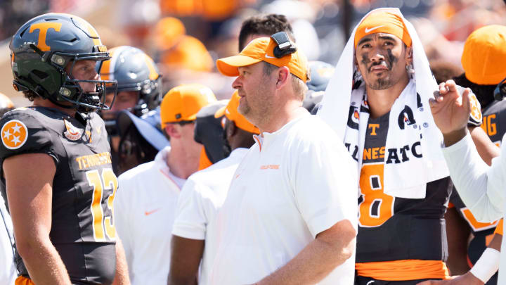 Tennessee head coach Josh Heupel speaks with Tennessee quarterback Gaston Moore (13) with Tennessee quarterback Nico Iamaleava (8) behind him, during a game between Tennessee and Chattanooga, Saturday, Aug. 31, 2024.