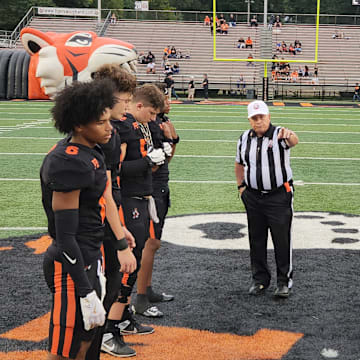 Massillon (Ohio) and Bergen Catholic (New Jersey) players receive instructions at the opening coin toss on Septmeber 6, 2024. 