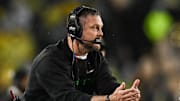 Nov 8, 2025; Iowa City, Iowa, USA; Oregon Ducks head coach Dan Lanning calls a timeout during the third quarter against the Iowa Hawkeyes at Kinnick Stadium. Mandatory Credit: Jeffrey Becker-Imagn Images