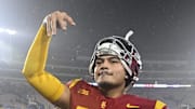 Nov 23, 2024; Pasadena, California, USA;  USC Trojans quarterback Jayden Maiava (14) celebrates the win over UCLA at Rose Bowl. Mandatory Credit: Robert Hanashiro-Imagn Images