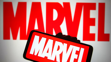 In this photo illustration a Marvel logo is seen on a...