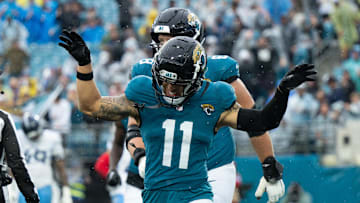 Dec 29, 2024; Jacksonville, Florida, USA;  Jacksonville Jaguars wide receiver Parker Washington (11) celebrates his touchdown against the Tennessee Titans in the second quarter at EverBank Stadium. Mandatory Credit: Jeremy Reper-Imagn Images