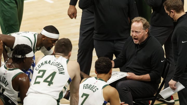 Jun 25, 2021; Milwaukee, Wisconsin, USA; Milwaukee Bucks head coach Mike Budenholzer talks to