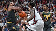 Baylor Bears forward Norchad Omier (15) is fouled by Gonzaga Bulldogs guard Khalif Battle (99) in the second half of the Zags' 101-63 win on Monday night.