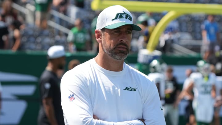 East Rutherford, NJ -- August 10, 2024 -- Aaron Rodgers, who wasn't dressed to play, during pre game warm ups as the Washington Commanders came to MetLife Stadium to play the New York Jets in the first preseason game of the 2024 season.