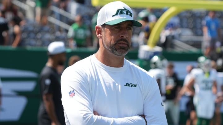 East Rutherford, NJ -- August 10, 2024 -- Aaron Rodgers, who wasn't dressed to play, during pre game warm ups as the Washington Commanders came to MetLife Stadium to play the New York Jets in the first preseason game of the 2024 season.