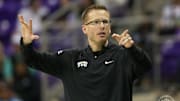 TCU women's basketball coach Mark Campbell directs the team against Cincinnati. 