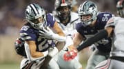 Kansas State redshirt sophomore running back Anthony Frias II (26) gains a few extra yards on a play in the fourth quarter of Saturday's game against Southeast Missouri State inside Bill Snyder Family Stadium.