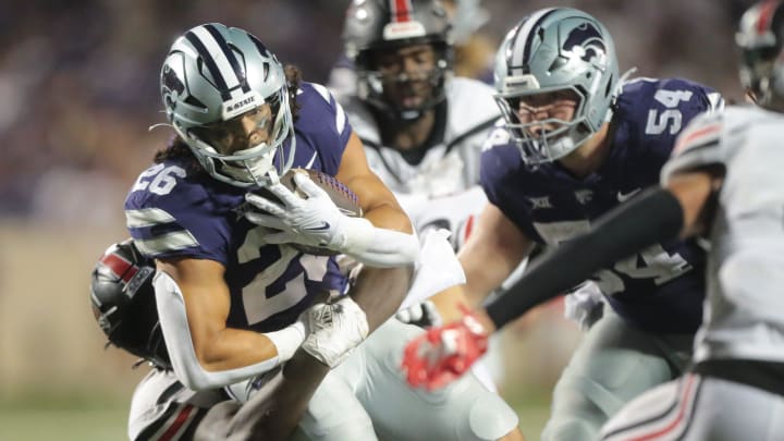 Kansas State redshirt sophomore running back Anthony Frias II (26) gains a few extra yards on a play in the fourth quarter of Saturday's game against Southeast Missouri State inside Bill Snyder Family Stadium.